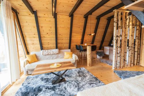 a living room with a couch and a table at Eka's Village in Plav