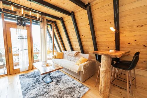 a living room with a couch and a table at Eka's Village in Plav