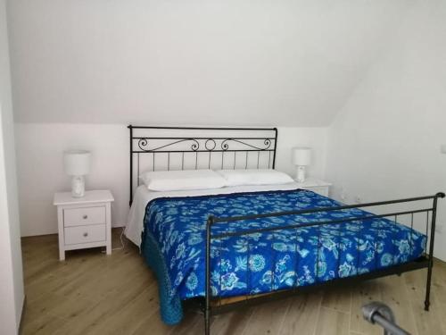 Ένα ή περισσότερα κρεβάτια σε δωμάτιο στο L' appartamento Da Fiora