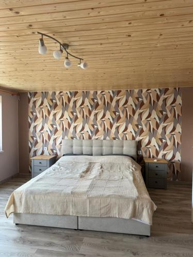 Postel nebo postele na pokoji v ubytování Greta ház