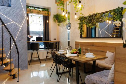 a dining room with a table and chairs at LEO Apartment FREE PARKING - President Palace in Bratislava