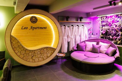 a room with a purple couch and a sign that reads lo apartment at LEO Apartment FREE PARKING - President Palace in Bratislava
