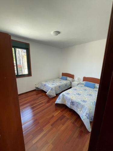 Postel nebo postele na pokoji v ubytování CASA COMPLETA DE VILELA