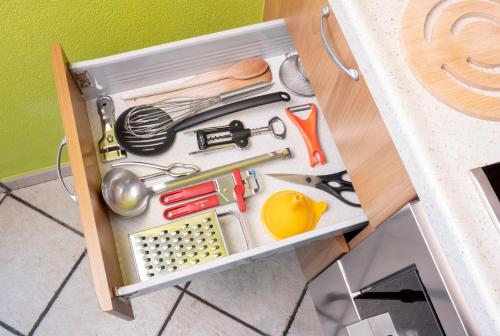 a drawer full of kitchen utensils on a table at Chalet Rosita in Livigno