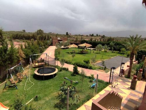 an aerial view of a park with a trampoline at Auberge Kenza in Tahannout