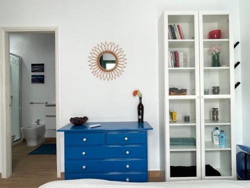 a blue dresser in a room with a mirror at Casita MATILDA Puerto del Carmen in Puerto del Carmen