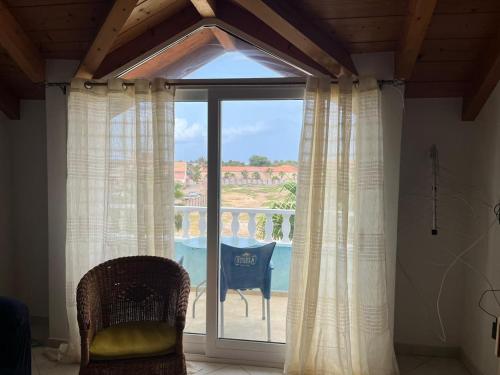 a room with a window with a view of a patio at Soleil A9 in Santa Maria
