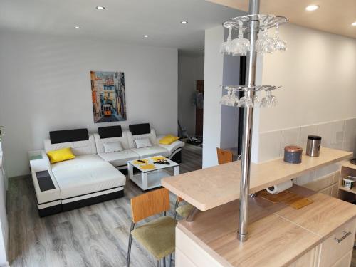 a living room with a couch and a table at Cocon Zeitz in Zeitz