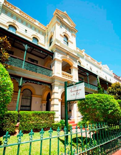 a building with a sign in front of it at Avonmore On The Park Boutique Hotel in Sydney