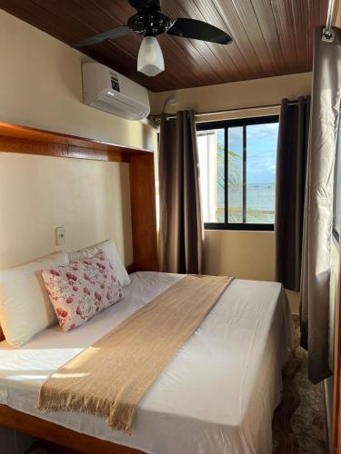 Postel nebo postele na pokoji v ubytování Cantinho do Eden - Pontal de Coruripe - em frente a praia com garage privativo