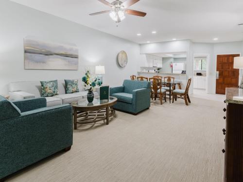 a living room with a couch and chairs and a table at Southwind II at Shipyard in Hilton Head Island