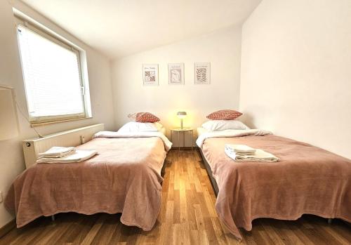 Postel nebo postele na pokoji v ubytování Airport Messe Hotel