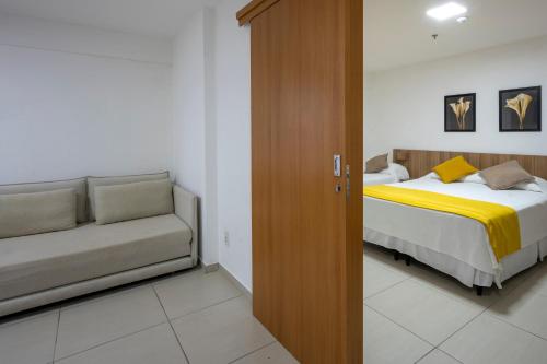 Ένα ή περισσότερα κρεβάτια σε δωμάτιο στο Villa Park Hotel Recife