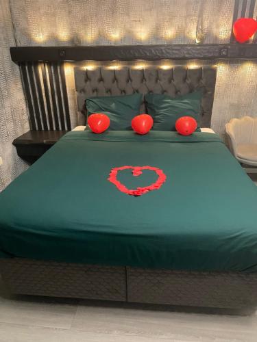 a bed with a superman logo on it at Jungle suite romantic - private Jacuzzi - in Brussels
