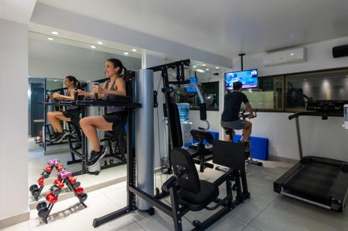 a man and a woman in the gym at Urban Suites Recoleta Boutique Hotel in Buenos Aires