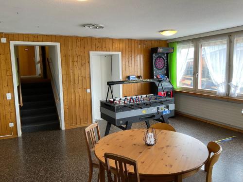 a room with a table and a ping pong tableablish at 22 - Gästehaus Erika - Hundwil - Appenzellerland in Hundwil