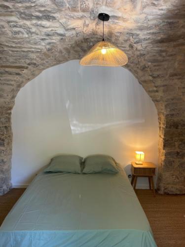 Ένα ή περισσότερα κρεβάτια σε δωμάτιο στο Maison de Village