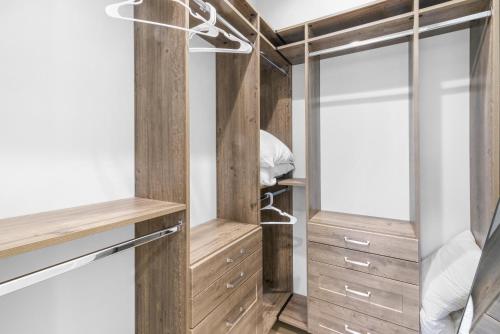 a walk in closet with wood paneling and mirrors at Port Place Paradise in Ottawa