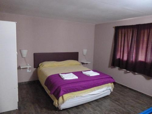 Ένα ή περισσότερα κρεβάτια σε δωμάτιο στο La Pausa