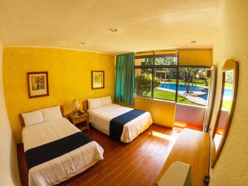 Postel nebo postele na pokoji v ubytování Hotel Calli
