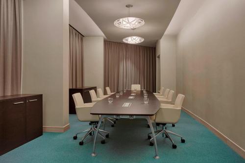 a conference room with a long table and chairs at Four Points by Sheraton Oran in Oran