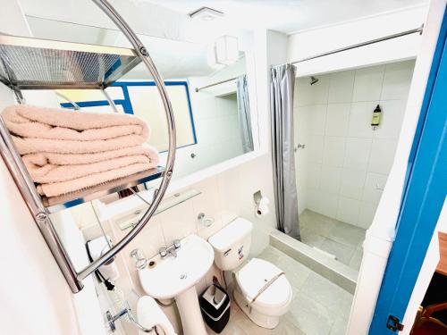 a bathroom with a sink and a toilet at Rojas Plaza Boutique in Cusco