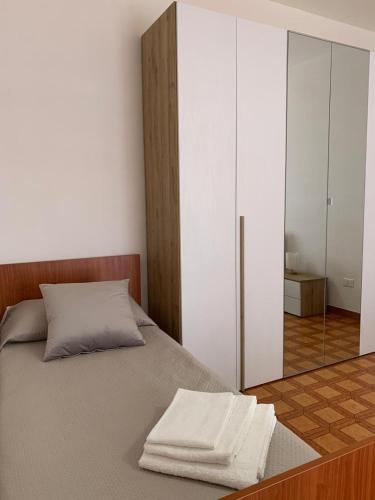a bedroom with a bed with a sliding glass door at Affittacamere da Anna in Pozzilli