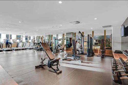 a gym with several treadmills and exercise bikes at Wsp high rise luxury 2b2b unit in Melbourne