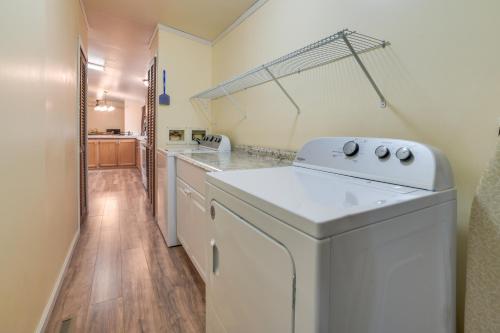 a kitchen with a washer and dryer in a room at Spacious De Tour Village Home Near Lake Huron! in De Tour Village