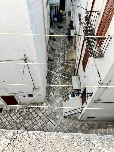 a collage of photos of an alley with a building at Casa Ventura in Putignano