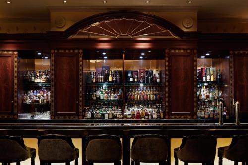 a bar with a lot of bottles of alcohol at The Westin Tokyo in Tokyo