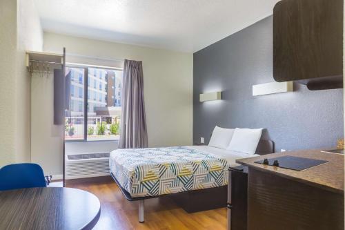 a hotel room with a bed and a window at Motel 6-Laredo, TX - Airport in Laredo