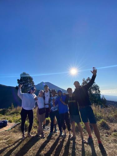 a group of people standing on top of a hill at Coconut Homestay Tetebatu in Tetebatu