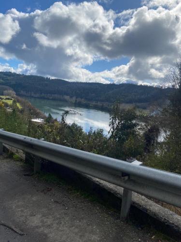 a view of a river from the side of a road at El Encanto de Antilhue in Valdivia