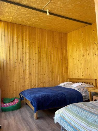 Mountain House in Jutaにあるベッド