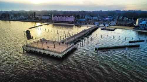 an aerial view of a dock in the water at Charming Beach House Top Floor - Walk Everywhere in North Beach