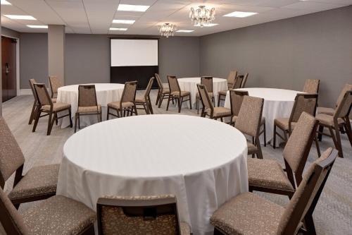 a conference room with tables and chairs and a screen at The Westin Governor Morris, Morristown in Morristown