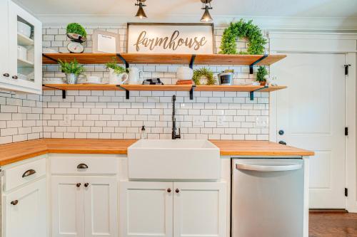 a kitchen with white cabinets and a sink at Family-Friendly Harrison Home 33 Mi to Branson! in Harrison