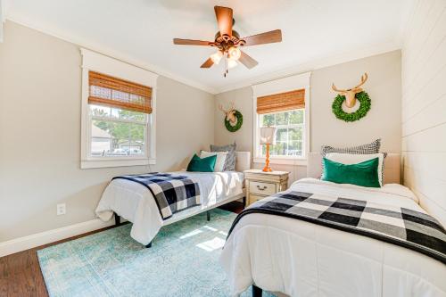 a bedroom with two beds and a ceiling fan at Family-Friendly Harrison Home 33 Mi to Branson! in Harrison