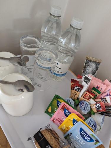a white counter with bottles of water and some food at The Manor House Inn in Shotley Bridge