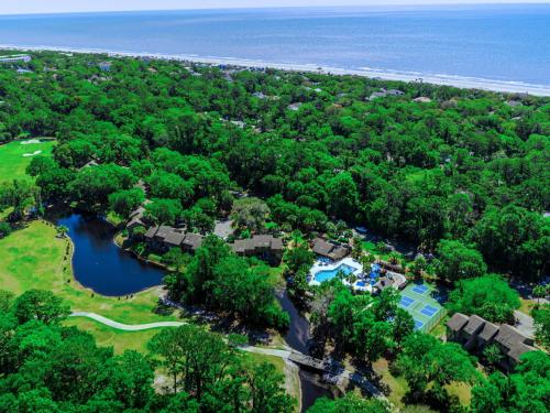 an aerial view of a resort with a lake and trees at Spinnaker at Shipyard in Hilton Head Island