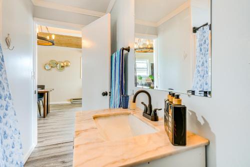 a kitchen with a sink and a counter top at Serene Lakefront Standish Home with Fire Pit and Grill in Standish