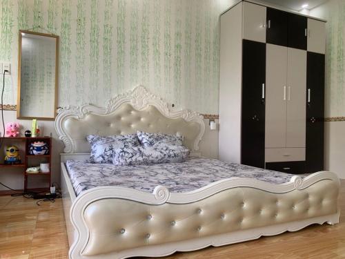 Postel nebo postele na pokoji v ubytování Thủ Đức Home - Nơi nghỉ ngơi như ở nhà, ấm áp tình thân