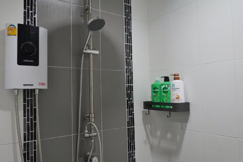 a shower in a bathroom with a shower at Cozy house in Chiang Mai