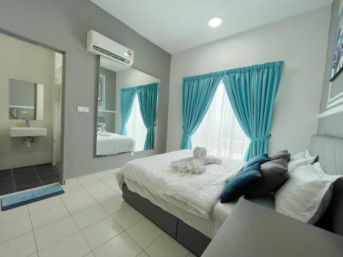 a bedroom with a large bed and a mirror at MesaHill Homestay, Nilai by S&T Homez in Nilai