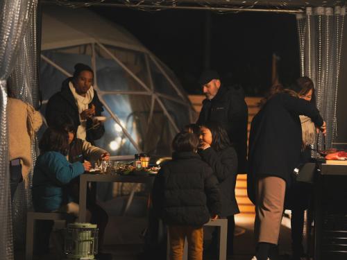 a group of people standing around a table with wine glasses at Seage Torami Coastside in Ichinomiya