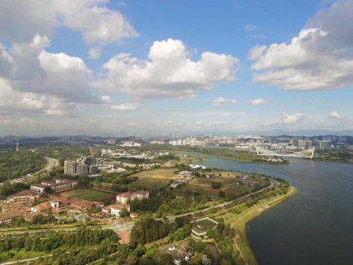 an aerial view of a city next to a body of water at La Casa in Cyberjaya