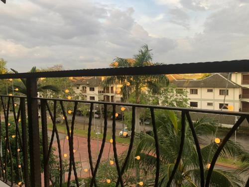 a balcony with a view of a street and buildings at La Casa in Cyberjaya