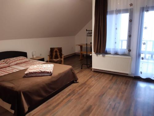 Postel nebo postele na pokoji v ubytování Casa Tăslovan