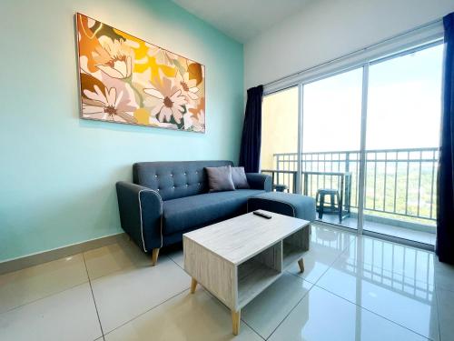a living room with a couch and a coffee table at MesaHill Homestay, Nilai by S&T Homez in Nilai